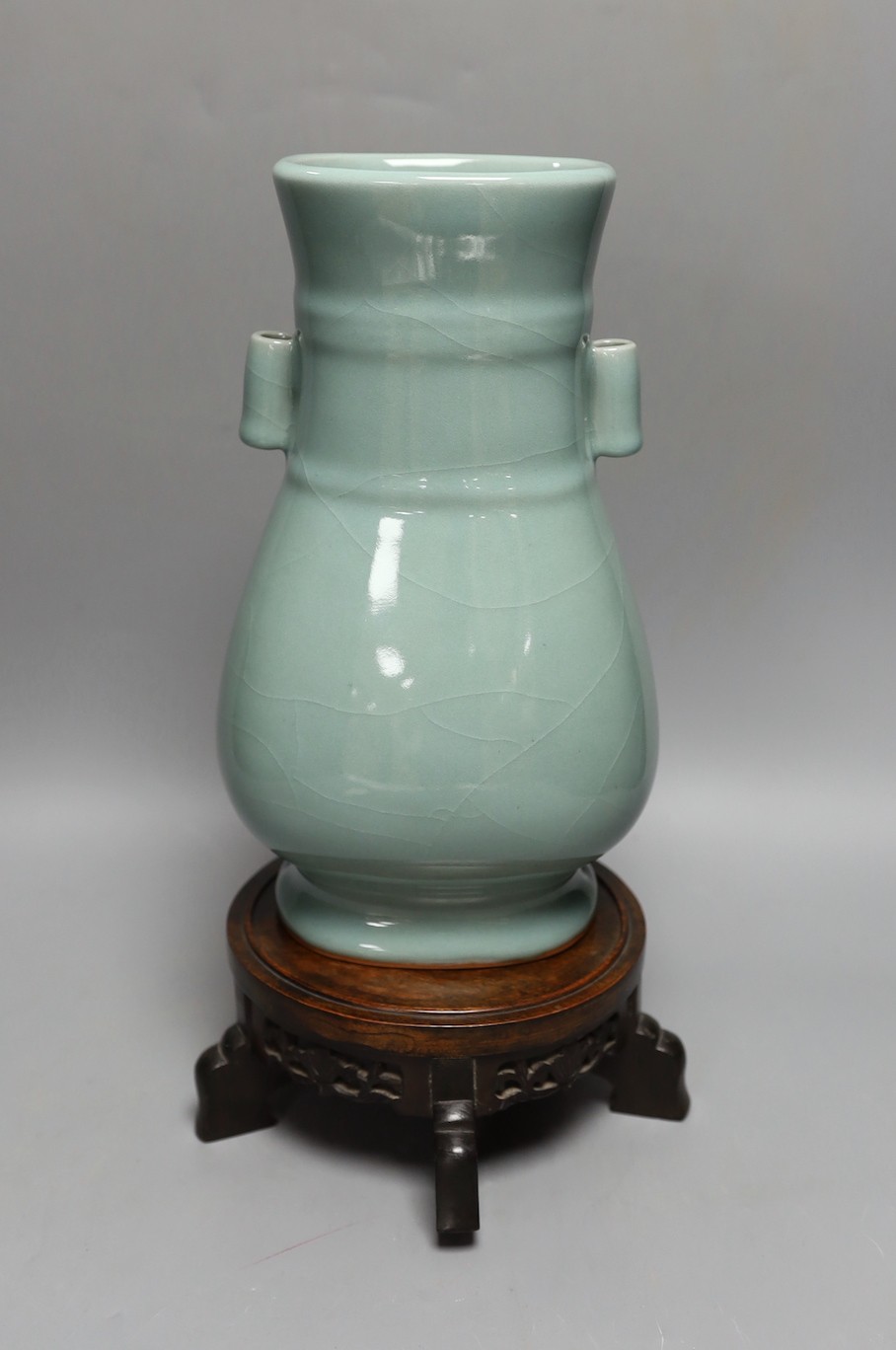 A Chinese celadon glazed arrow vase on a stand 35cm total height